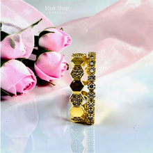 Gold Chaumet-inspired connected double ring with geometric and textured bands