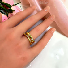 Gold Chaumet-inspired connected double ring worn on hand