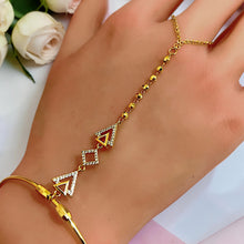 Close-up of clear-stone triangle and square geometric hand chain – Misk Shop
