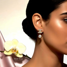 Close-up model view of Chanel inspired zircon and pearl drop earring