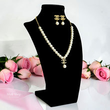 Full Chanel inspired pearl necklace and earrings jewelry set on black display