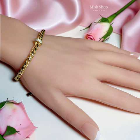 18K gold plated Cuban chain bracelet with a sparkling zircon center ring and adjustable extension for women by Misk Shop.