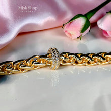 18K gold plated Cuban chain bracelet with a sparkling zircon center ring and adjustable extension for women by Misk Shop.