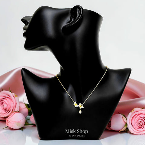 Medium-length 18K gold plated 304 stainless steel necklace with two zircon butterflies and a teardrop charm by Misk Shop.