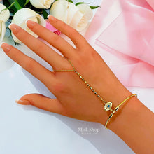 18K gold plated evil eye hand chain bracelet on hand - Misk Shop