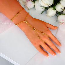 Delicate 18K gold plated hand chain bracelet with bead accents - Misk Shop