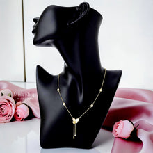 Long 18K gold plated 304 stainless steel necklace with a natural mother-of-pearl butterfly, zircon accents, and twin drop chains by Misk Shop.