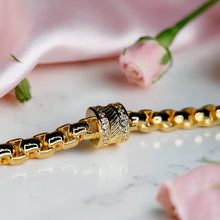 Luxury 18K gold plated chain bracelet with a sparkling zircon cylinder centerpiece and adjustable extension for women by Misk Shop.