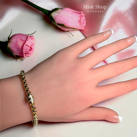 Luxury 18K gold plated chain bracelet with a sparkling zircon cylinder centerpiece and adjustable extension for women by Misk Shop.