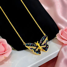 Close-up of Misk Shop 18K gold plated 304 stainless steel butterfly necklace with black detailing and multicolored zircon stones