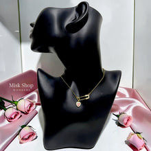 Medium-length 18K gold plated titanium steel safety pin necklace with a pink heart charm and 3A zircon stones by Misk Shop.