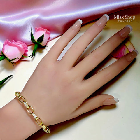 18K gold plated adjustable link bracelet with sparkling zircon details and extension chain for women by Misk Shop.