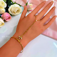 Elegant 18K gold plated open cuff hand chain with zircon bow centerpiece - Misk Shop