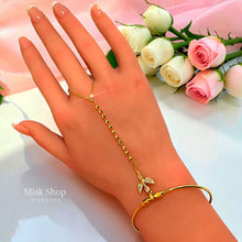 Gold plated hand chain bracelet showing open back cuff design - Misk Shop
