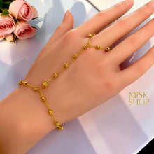 21K gold plated bubble bead hand chain bracelet worn across the hand