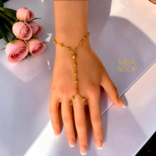 Full view of a 21K gold plated textured bead hand chain bracelet