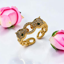 Free-size 21K gold plated Cartier Inspired double panther ring with 5A zircon and green eyes by Misk Shop.
