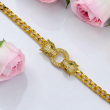 Close-up of 21K gold plated Cartier Inspired panther bracelet with 5A zircon and green eye details by Misk Shop.
