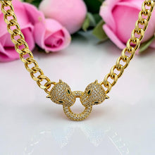 Close-up of 21K gold plated Cartier Inspired panther necklace with 5A zircon and green eye details by Misk Shop.