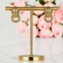 Pair of 21K gold plated Cartier Inspired panther earrings with circular 5A zircon details by Misk Shop.