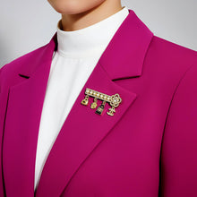 Handcrafted 21K gold plated Chanel-inspired charm brooch with pearls and zircon stones by Misk Shop.