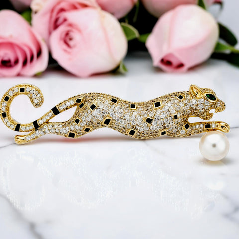 Handcrafted 21K gold plated leopard brooch with zircon stones and pearl by Misk Shop.