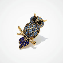 Handcrafted 21K gold color owl brooch with sparkling zircon stones available in gold and navy blue by Misk Shop.