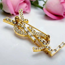 Handcrafted 21K gold color Saint Laurent inspired YSL brooch decorated with sparkling round and baguette zircon stones by Misk Shop.