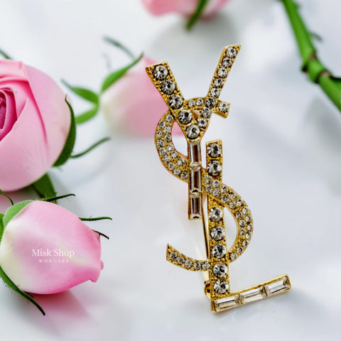 Handcrafted 21K gold color Saint Laurent inspired YSL brooch decorated with sparkling round and baguette zircon stones by Misk Shop.