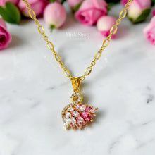Luxury 21K gold color triple layer necklace featuring a pink swan pendant decorated with white and pink marquise zircon stones by Misk Shop.