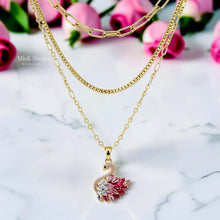 Luxury 21K gold color triple layer necklace featuring a pink swan pendant decorated with white and pink marquise zircon stones by Misk Shop.