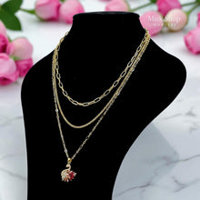Luxury 21K gold color triple layer necklace featuring a pink swan pendant decorated with white and pink marquise zircon stones by Misk Shop.