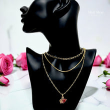 Luxury 21K gold color triple layer necklace featuring a pink swan pendant decorated with white and pink marquise zircon stones by Misk Shop.