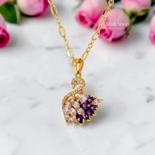 Luxury 21K gold color triple layer necklace featuring a purple swan pendant decorated with white and purple marquise zircon stones by Misk Shop.