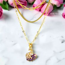 Luxury 21K gold color triple layer necklace featuring a purple swan pendant decorated with white and purple marquise zircon stones by Misk Shop.