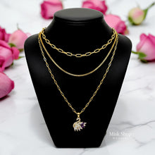 Luxury 21K gold color triple layer necklace featuring a purple swan pendant decorated with white and purple marquise zircon stones by Misk Shop.