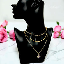 Luxury 21K gold color triple layer necklace featuring a purple swan pendant decorated with white and purple marquise zircon stones by Misk Shop.