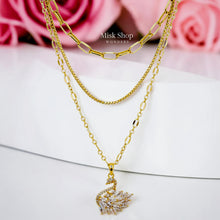 Luxury 21K gold color triple layer necklace with a swan pendant decorated with marquise zircon stones by Misk Shop.