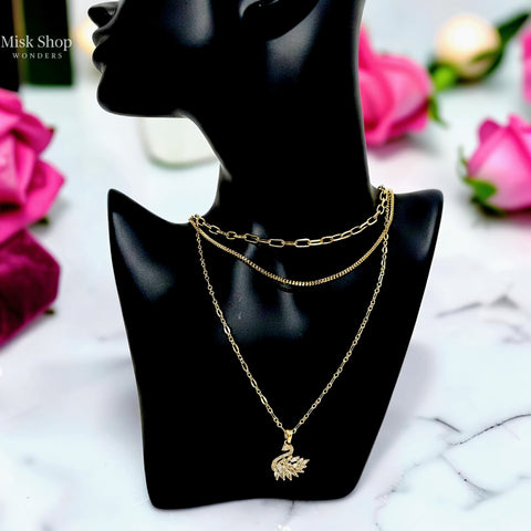 Luxury 21K gold color triple layer necklace with a swan pendant decorated with marquise zircon stones by Misk Shop.