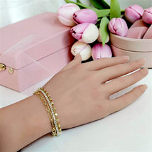 Connected triple-row bracelet with gold paperclip links, zircon and gold beads worn on wrist