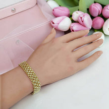 Gold-plated wide mesh-style shawl bracelet worn on wrist with layered interlocking links