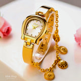 Close-up of a MissFox gold bracelet watch with side chain by Misk Shop.