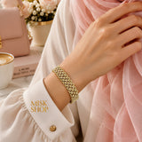 Wide flexible woven gold shawl bracelet with polished interlocking links worn on wrist