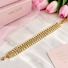 Gold 3-in-1 connected bracelet with round gold beads and clear zircon center strands