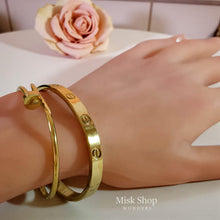 Minimal gold nail bangle 18K plated stainless steel no stones
