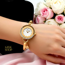 Binda yellow gold plated moving crystal bangle watch worn on the wrist