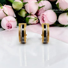 Close-up front view of matching Boucheron-inspired hoop earrings