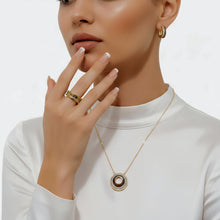 Boucheron-inspired circular pendant necklace and hoop earrings worn together