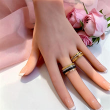Boucheron-inspired multi-tone rings displayed on hand