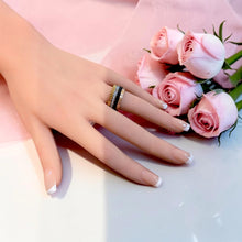 Gold black and rose gold zirconia ring worn on hand
